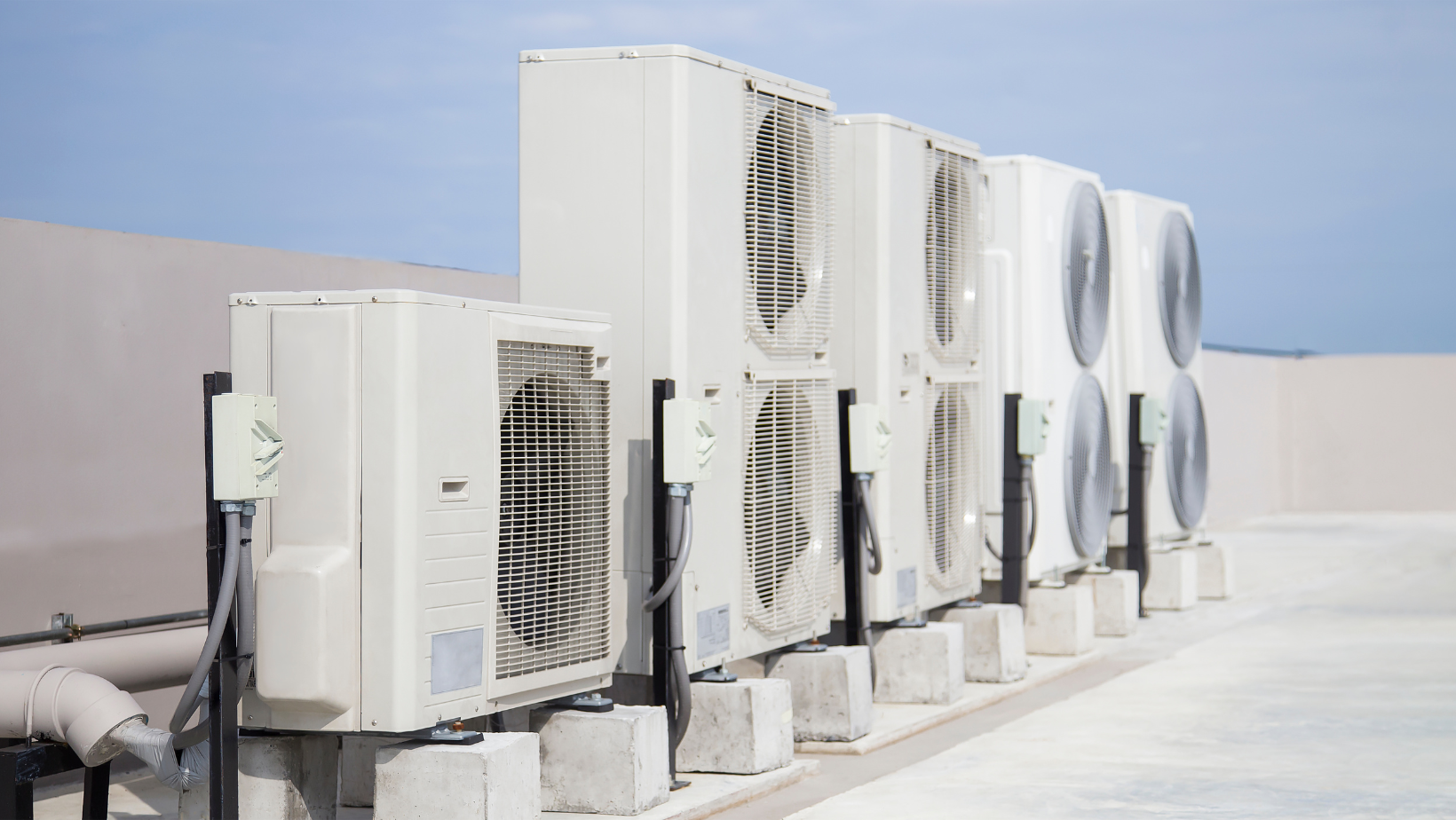 Air conditioning units installed on a rooftop, showcasing a modern urban building's climate control system.