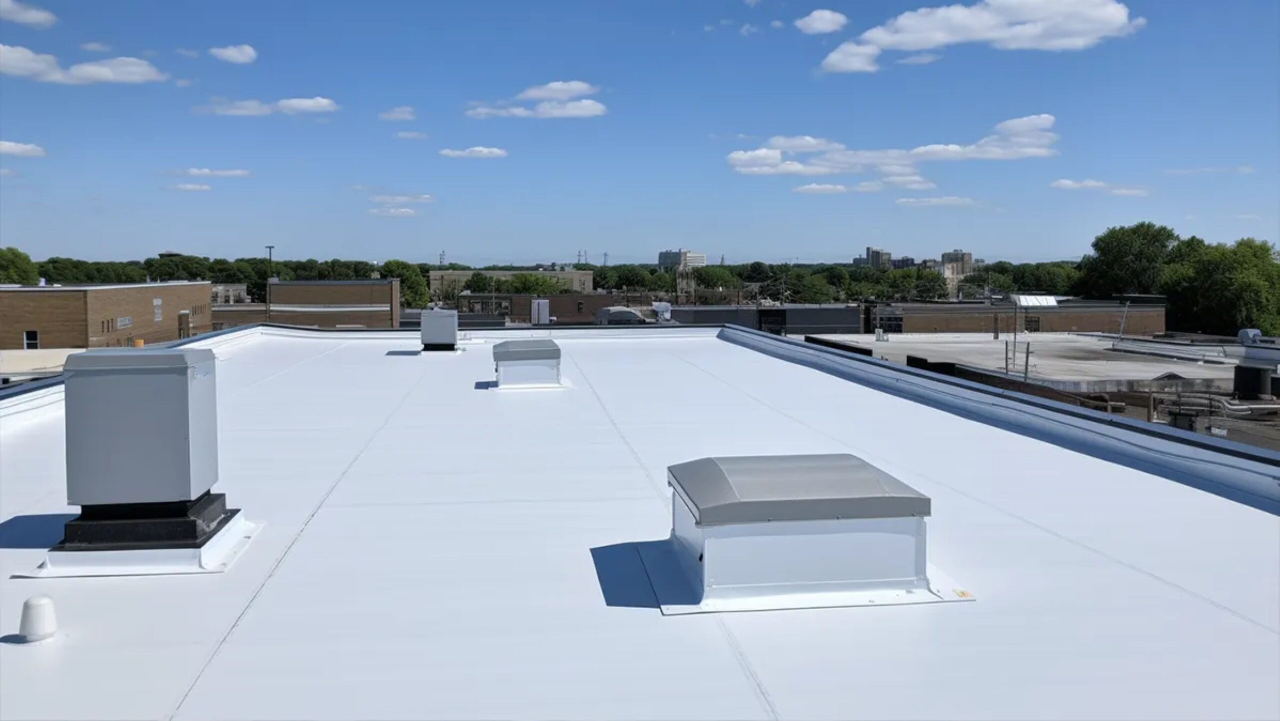 A flat roof equipped with several vents, enhancing airflow and ventilation efficiency.