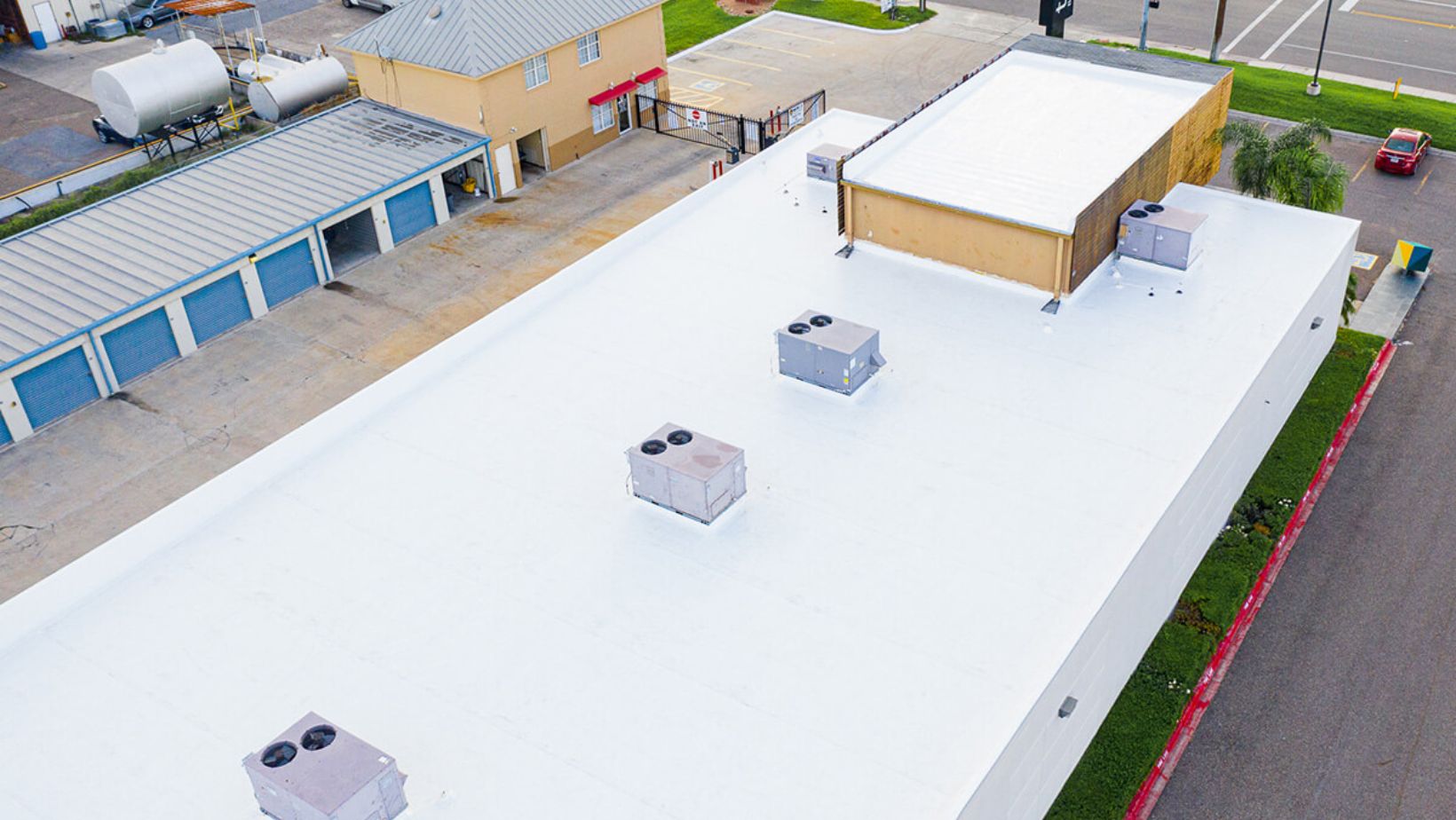 Aerial perspective of a white roof with two air conditioning units