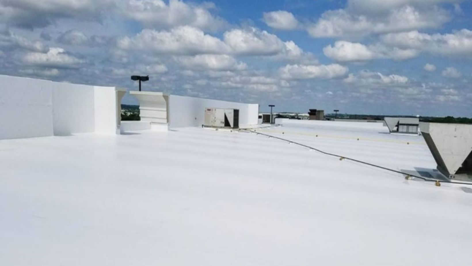 A roof covered in fresh white coating