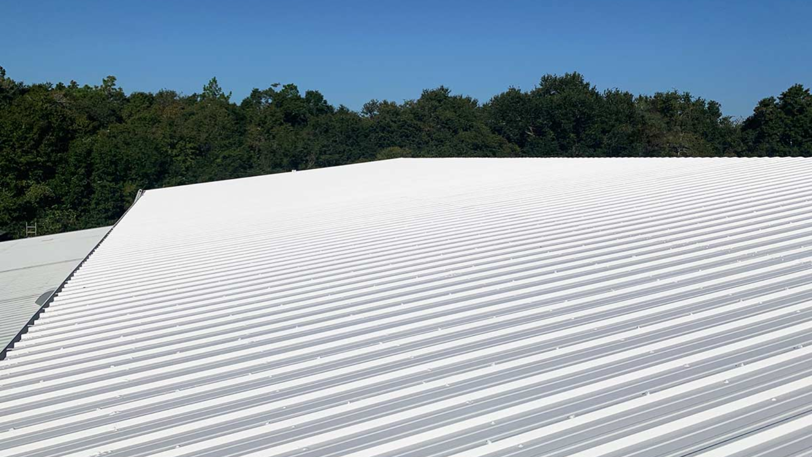 A white roof against a clear blue sky