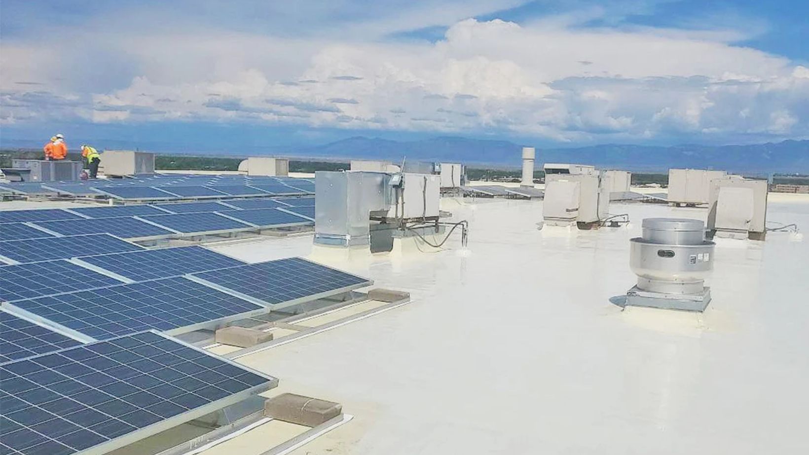 Solar panels installed on the roof of a modern building