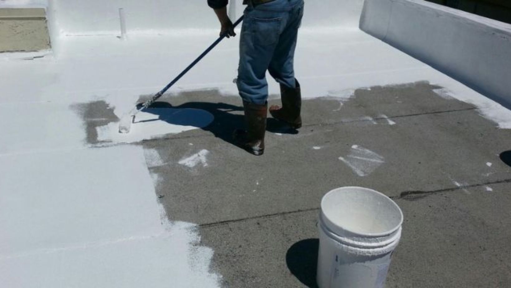 A man is getting it ready for a fresh coat.